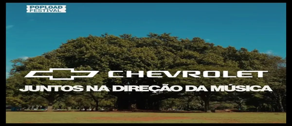 Logo da Chevrolet com a frase “Juntos na Direção da Música” sobre fundo de árvores no Parque Ibirapuera, com selo do Popload Festival no canto superior.