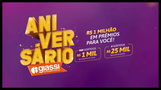 A imagem apresenta a campanha de aniversário dos Supermercados Giassi com destaque para o prêmio total de R$ 1 milhão. O visual tem fundo roxo e letras amarelas chamativas. São anunciados 900 sorteios de R$ 1 mil em compras nas lojas Giassi e mais 4 sorteios de R$ 25 mil em carteira digital. O logotipo da rede Giassi está incluído na arte promocional.